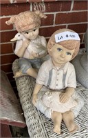 large ceramic boy and girl holding duck statue