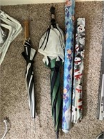 2 rolls of Christmas wrapping paper, 2 umbrellas,