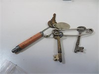 3 Keys & Mechanical Pencil on Safety Pin