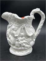 EMBOSSED FIGURAL PORCELAIN WATER PITCHER