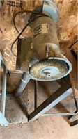 BENCH GRINDER ATTACHED TO POLE AND PLYWOOD