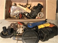 Box of assorted valves, caps and more.