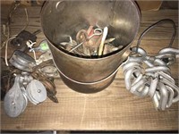 Pail of wire rope thimbles, threaded J hooks and