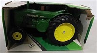 Die-cast John Deere Model R toy tractor
