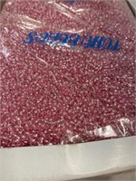 Toho 10/0 glass round seed bead. Pink lined