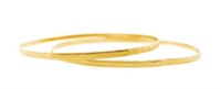 Two 18ct yellow gold faceted bangles