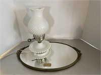 Vanity mirror and milk glass lamp