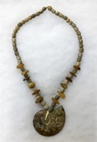 Necklace with Fossilized Ammonite Pendant.