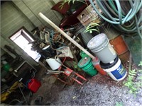 Misc. scrap metal, pumps, trash cans, hose, gas