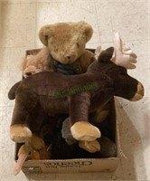 Box of toys includes a large stuffed moose, a