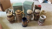 7 lidded beer steins and 4 small steins. LOCAL