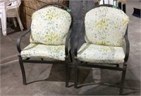 Two iron patio chairs w/cushions