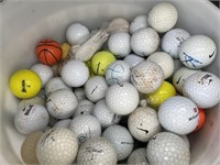 Bucket of used golf balls