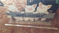 wooden pig welcome sign
