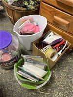 trash can of tissue paper, tub of cupcake liners,
