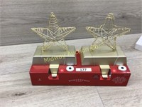 2 GOLD COLOR STAR STOCKING HOLDERS