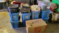 Totes and boxes containing assorted clothing
