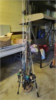 (12) fishing poles on rack