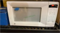 GE white countertop microwave. Measures 20” x