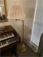 Brass floor lamp and wall mirror