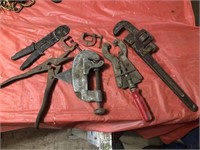 Assortment of tools, pipe cutters, small clamps,
