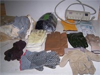 Large assortment of gloves, some are used