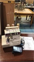 Riccar Serger model RL613E, with the instruction