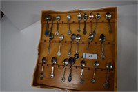 Collector Spoons on Wooden Display