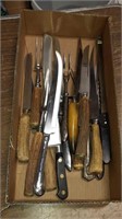 Log with vintage carving knife and forks