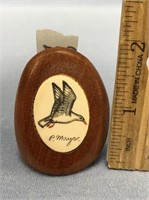 2" x 11/2" scrimmed bird on ivory set in wood disp