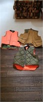 Three assorted hunting vests