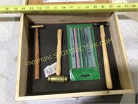 Wood box with small hammers and file stones