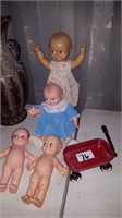 4 Kewpie Dolls & little wagon