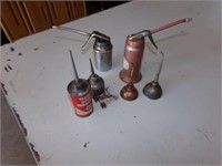 6 small oil cans