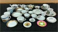 Souvenir porcelain plates,bowls & cups