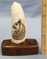 Scrimshawed whale's tooth 4.5" tall with a falcon