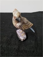 Beautiful Rock carved bird on Amethyst crystal