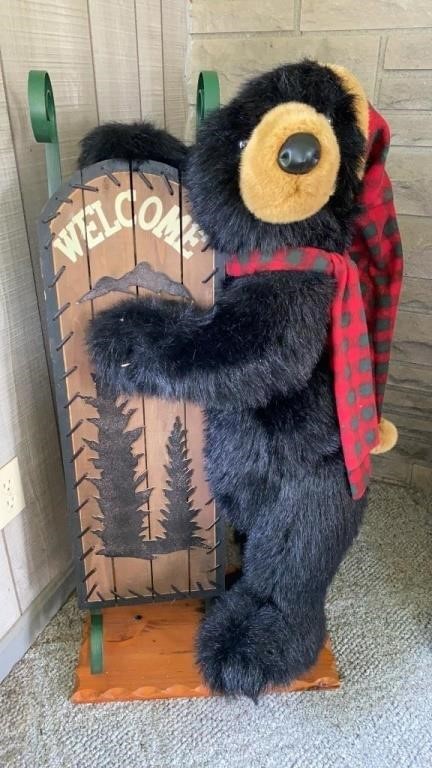 Stuffed Black Bear Hugging A Sled Welcome Sign