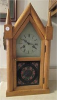 Antique wood clock measures 20" Tall, has key