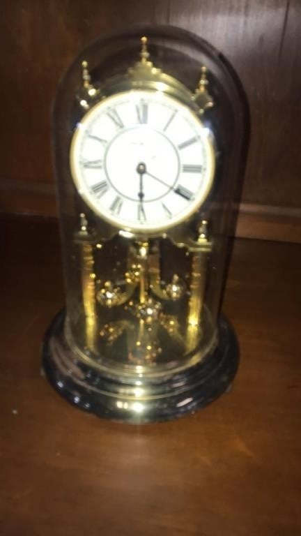 Howard Miller clock. Glass globe