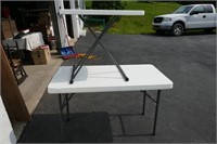 TWO PLASTIC TABLES WITH FOLDING LEGS