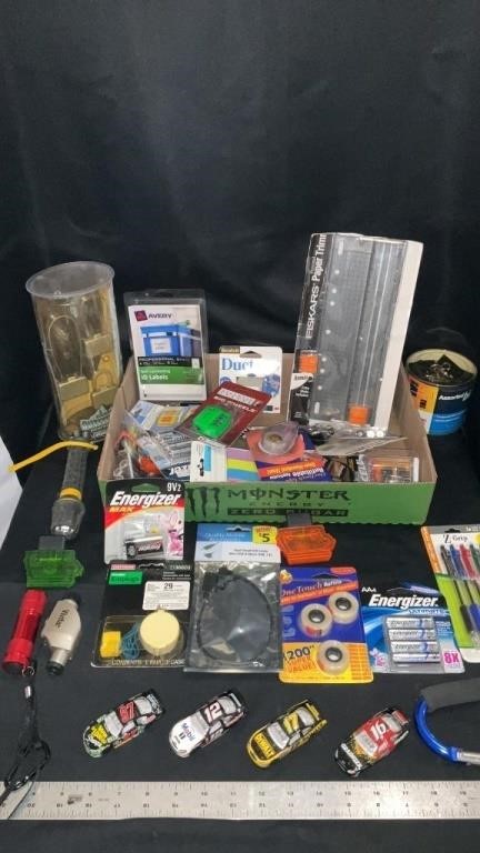 Various office supplies, toy cars, pens,