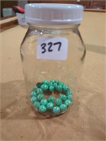Jar w green marbles