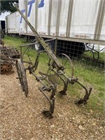 Antique plow- wheels need repair.