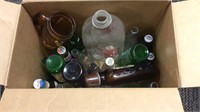 Box of assorted soda pop bottles & half Gal. Milk