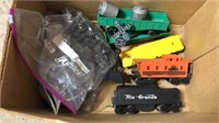 Box of model train parts. Several Lionel cars,