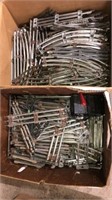 2 boxes of Lionel model train tracks and HO power