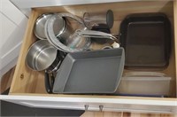 Bottom drawer full of bakeware, pans, etc