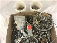 A ton of nuts and bolts, washers, screws, straps,