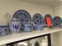 Shelf of blue patterned dishes
